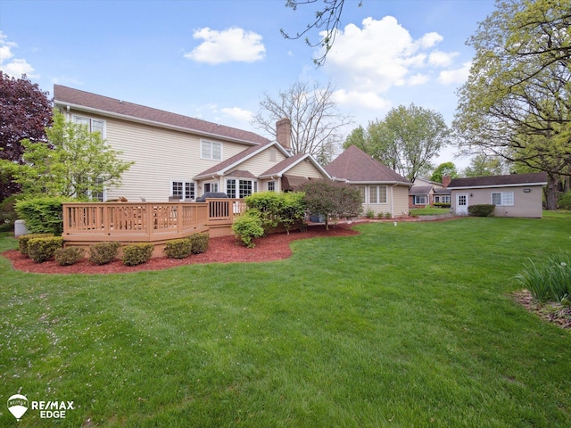 9705 Burning Tree Dr, Grand Blanc, MI 48439 - back of property with a lawn and a deck