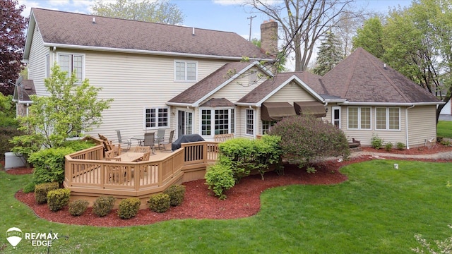 9705 Burning Tree Dr, Grand Blanc, MI 48439 - back of property with a chimney, a yard, a wooden deck, and roof with shingles