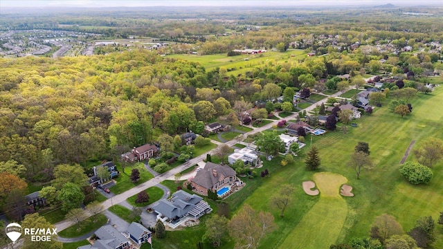 9705 Burning Tree Dr, Grand Blanc, MI 48439 - aerial overview of property's location featuring nearby suburban area and a forest