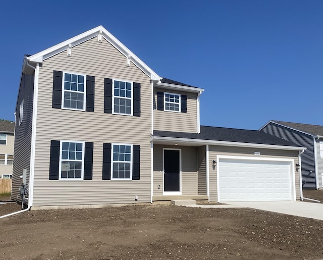 8811 E Sturtevant Ave, Richland, MI 49083 - view of front of home with concrete driveway and an attached garage