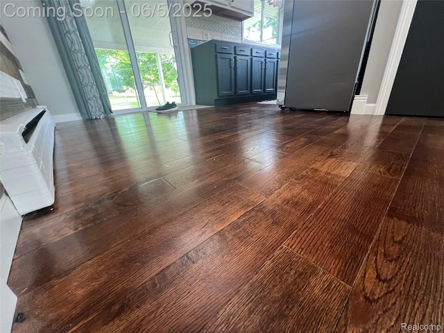 6255 Clarkston Rd, Clarkston, MI 48346 - unfurnished living room featuring dark wood-type flooring and baseboards