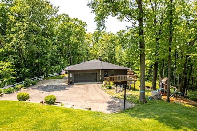 8680 Bennett St SE, Ada, MI 49301 - view of front of property with concrete driveway, a garage, a deck, a chimney, and a shingled roof