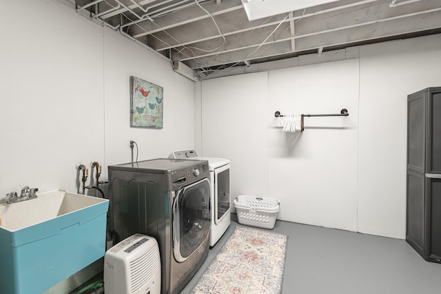 8680 Bennett St SE, Ada, MI 49301 - laundry area with washer and clothes dryer and a sink