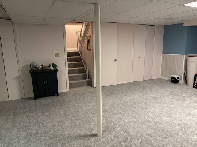 249 Churchgrove Rd, Frankenmuth, MI 48734 - finished basement featuring a drop ceiling, carpet, stairway, and wood walls