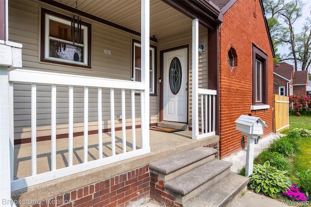 20811 Doepfer Rd, Warren, MI 48091 - doorway to property with brick siding and covered porch