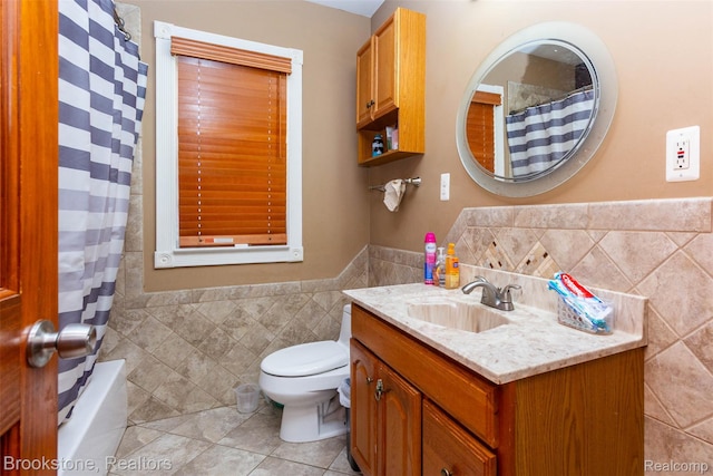 20811 Doepfer Rd, Warren, MI 48091 - bathroom with tile walls, vanity, tile patterned flooring, toilet, and wainscoting