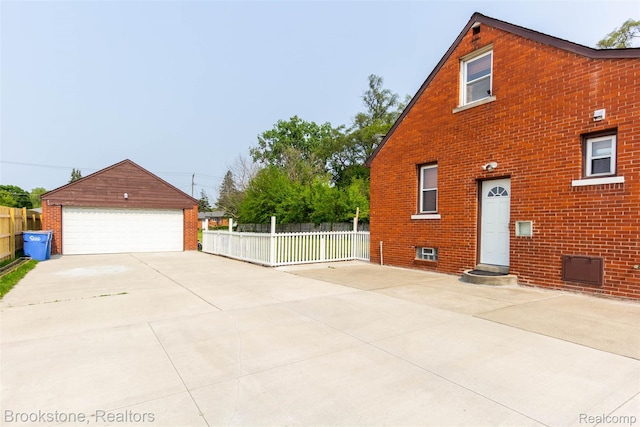 20811 Doepfer Rd, Warren, MI 48091 - view of side of home with brick siding, a garage, and an outbuilding