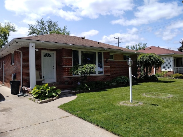 8383 Dixie Ln, Dearborn Heights, MI 48127 - bungalow-style home with brick siding, a front yard, and a shingled roof