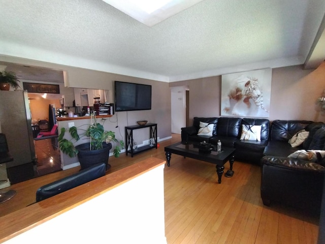 8383 Dixie Ln, Dearborn Heights, MI 48127 - living area featuring a textured ceiling and wood finished floors