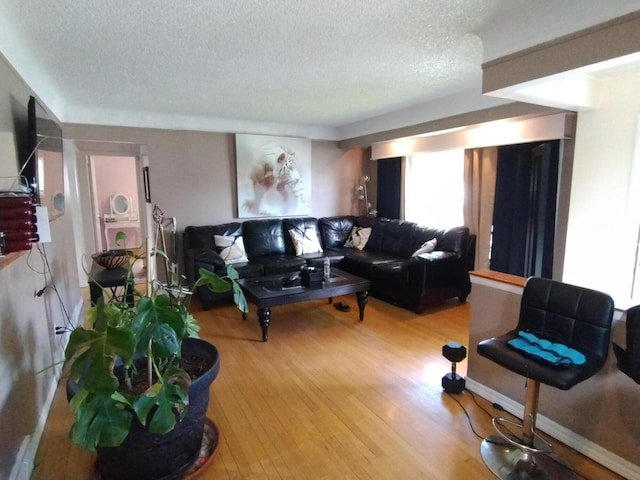 8383 Dixie Ln, Dearborn Heights, MI 48127 - living area with a textured ceiling and wood finished floors
