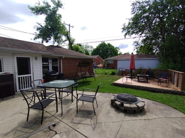 8383 Dixie Ln, Dearborn Heights, MI 48127 - view of patio / terrace featuring a fire pit, a deck, outdoor dining space, and grilling area