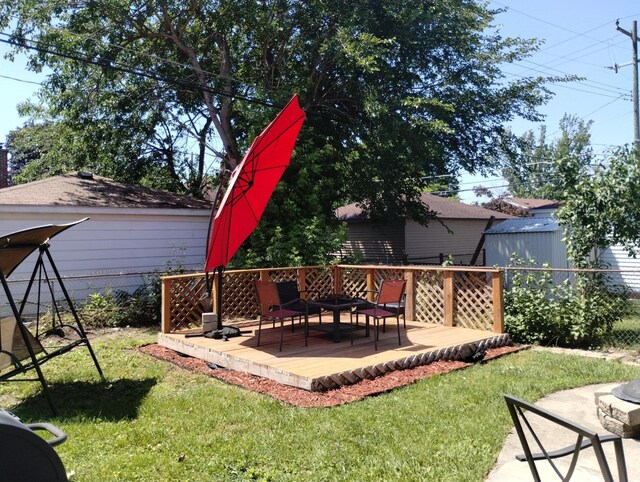 8383 Dixie Ln, Dearborn Heights, MI 48127 - view of yard featuring a deck and an outdoor fire pit