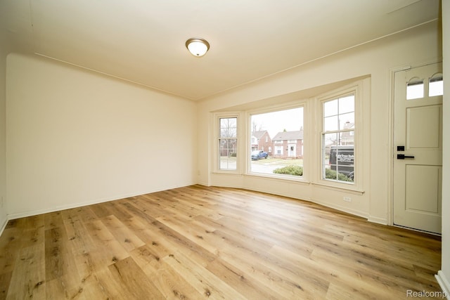 15400 Sprenger Ave, Eastpointe, MI 48021 - unfurnished room with light wood-type flooring and baseboards