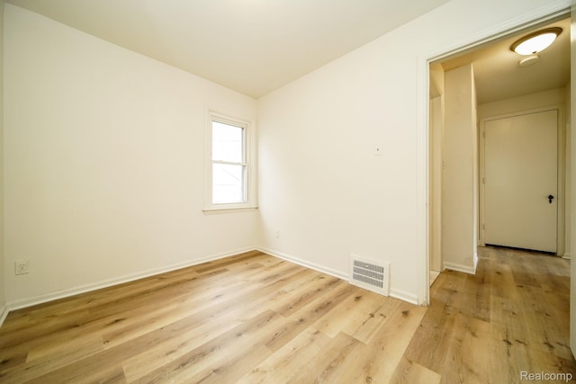 15400 Sprenger Ave, Eastpointe, MI 48021 - spare room with light wood finished floors, baseboards, and lofted ceiling