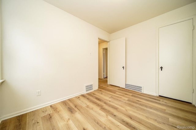 15400 Sprenger Ave, Eastpointe, MI 48021 - unfurnished bedroom featuring light wood-style floors and baseboards