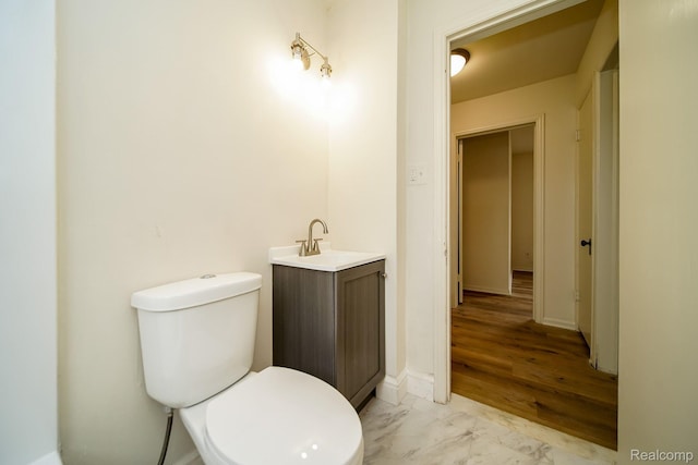 15400 Sprenger Ave, Eastpointe, MI 48021 - half bathroom with vanity, toilet, and marble finish floors