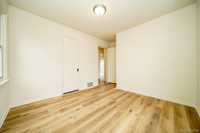 15400 Sprenger Ave, Eastpointe, MI 48021 - unfurnished bedroom featuring light wood-style flooring and baseboards