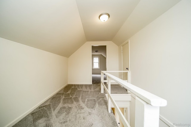 15400 Sprenger Ave, Eastpointe, MI 48021 - additional living space with light carpet, vaulted ceiling, and baseboards