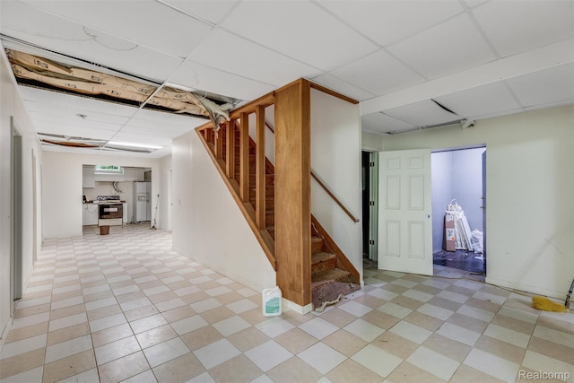 2479 Waterfront Dr, Brighton, MI 48114 - finished basement featuring a paneled ceiling and stairway