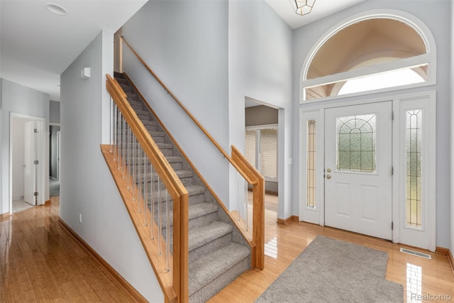 2479 Waterfront Dr, Brighton, MI 48114 - entryway featuring stairs, light wood-type flooring, and baseboards