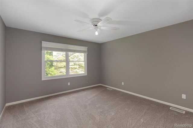 2479 Waterfront Dr, Brighton, MI 48114 - spare room featuring ceiling fan, baseboards, and carpet flooring