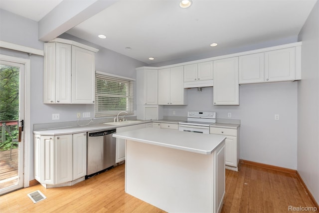 2479 Waterfront Dr, Brighton, MI 48114 - kitchen featuring stainless steel dishwasher, white electric range oven, a sink, white cabinetry, and recessed lighting