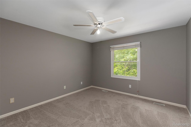 2479 Waterfront Dr, Brighton, MI 48114 - unfurnished room featuring baseboards, ceiling fan, and carpet