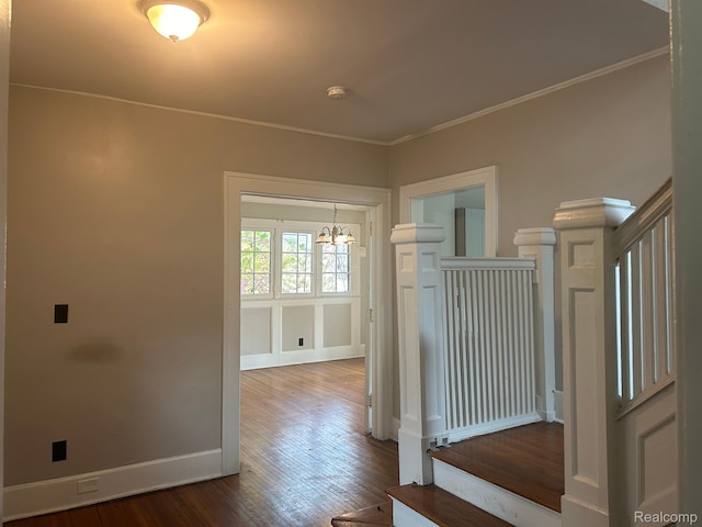 70 Colorado St, Highland Park, MI 48203 - hall featuring a chandelier, hardwood / wood-style floors, baseboards, and ornamental molding