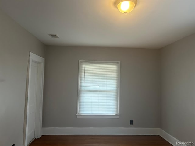 70 Colorado St, Highland Park, MI 48203 - spare room with dark wood-type flooring and baseboards
