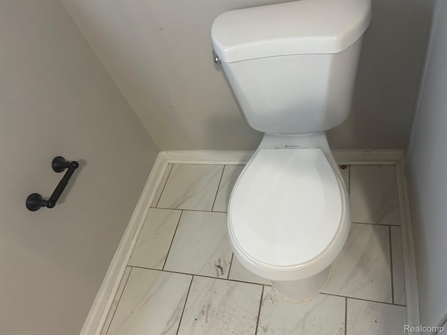 70 Colorado St, Highland Park, MI 48203 - bathroom featuring toilet and marble look tiles