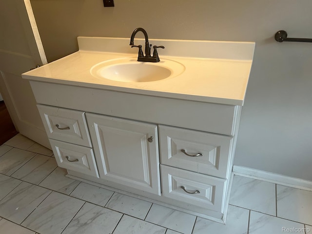 70 Colorado St, Highland Park, MI 48203 - bathroom featuring marble finish floors, vanity, and baseboards