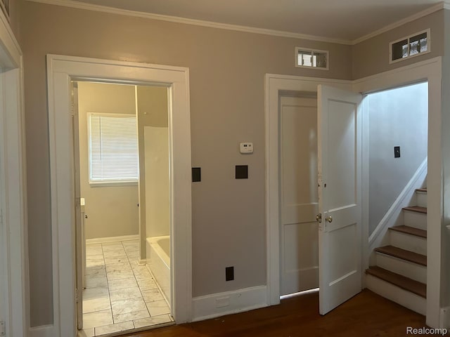 70 Colorado St, Highland Park, MI 48203 - hallway with baseboards, ornamental molding, stairs, and wood finished floors