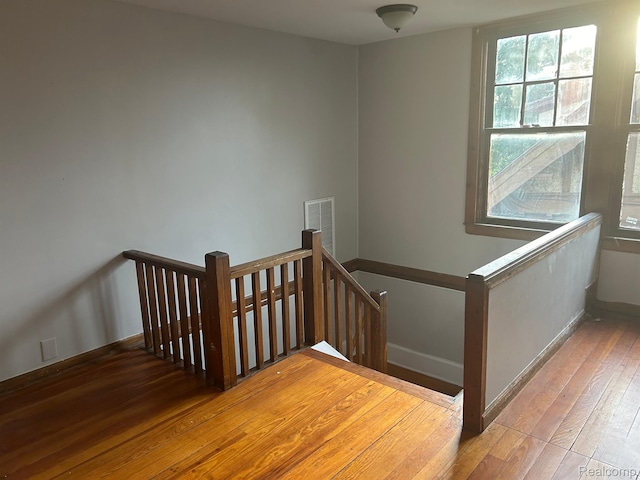 70 Colorado St, Highland Park, MI 48203 - staircase featuring wood-type flooring and baseboards