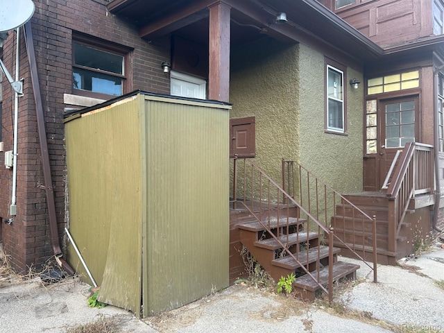 70 Colorado St, Highland Park, MI 48203 - view of side of property featuring stucco siding and brick siding