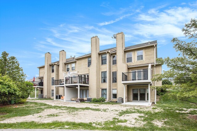 3451 Bent Trail Dr, Ann Arbor, MI 48108 - rear view of property with a balcony and central air condition unit