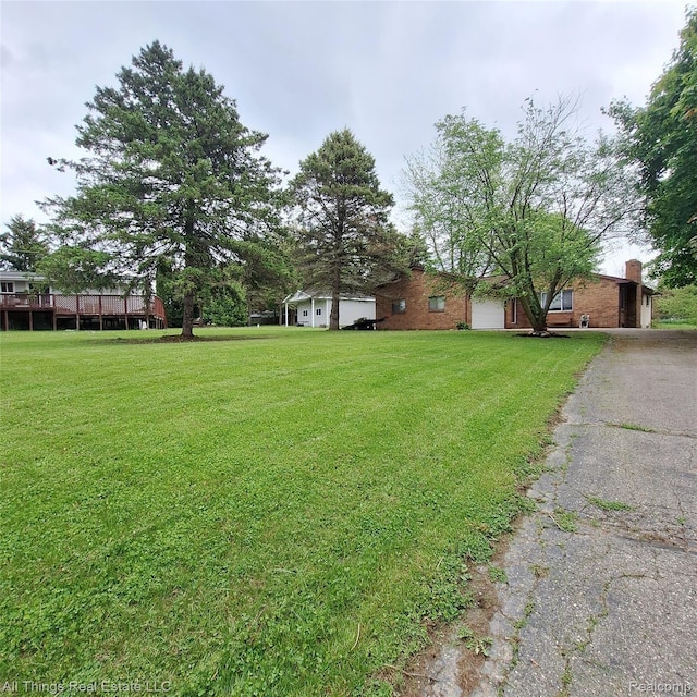 3827 Woodland Dr, Metamora, MI 48455 - view of grassy yard with driveway
