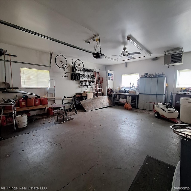 3827 Woodland Dr, Metamora, MI 48455 - garage featuring a garage door opener, a heating unit, and a workshop area
