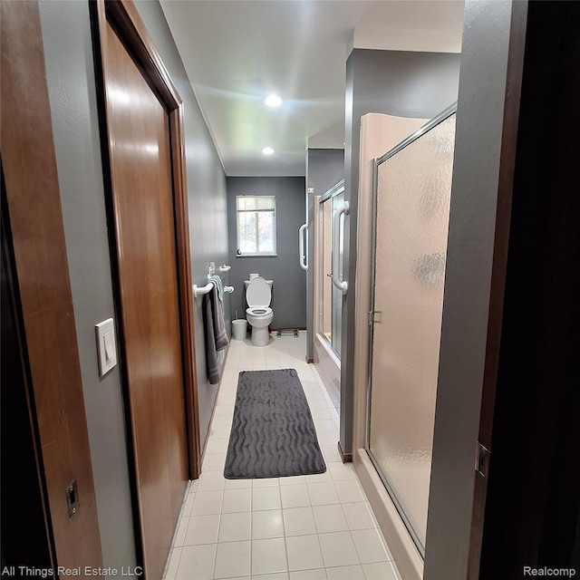 3827 Woodland Dr, Metamora, MI 48455 - bathroom featuring tile patterned floors, an enclosed shower, toilet, and recessed lighting