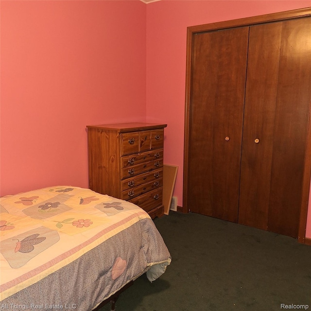 3827 Woodland Dr, Metamora, MI 48455 - bedroom with dark colored carpet and a closet
