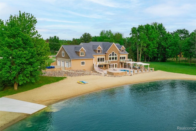 6312 S Graham Rd, Saint Charles, MI 48655 - rear view of property featuring a yard, an outdoor pool, and a water view