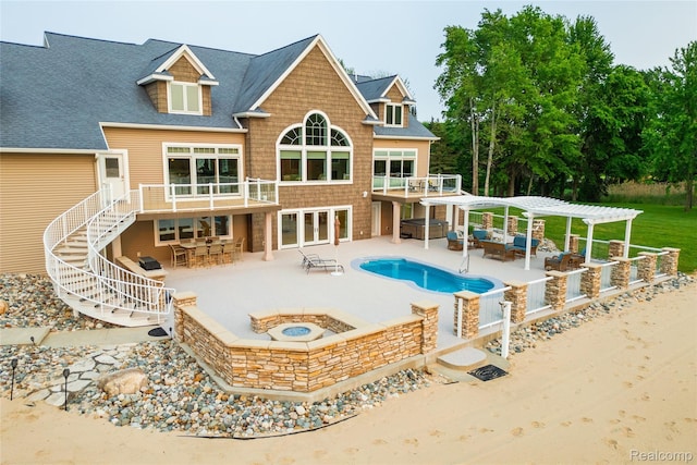 6312 S Graham Rd, Saint Charles, MI 48655 - back of property with a fire pit, a pergola, roof with shingles, an outdoor pool, and a patio