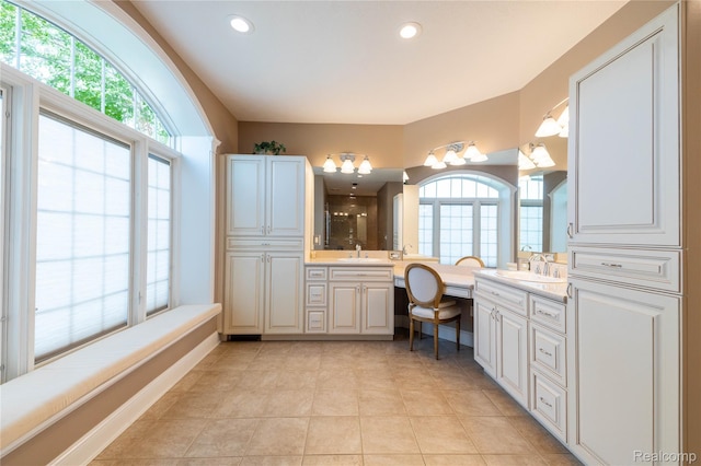 6312 S Graham Rd, Saint Charles, MI 48655 - bathroom with double vanity, healthy amount of natural light, tile patterned flooring, and recessed lighting
