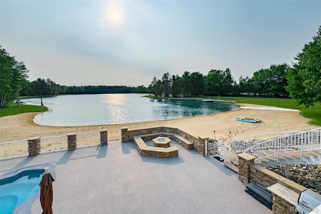 6312 S Graham Rd, Saint Charles, MI 48655 - view of pool with a water view, an outdoor fire pit, and a patio