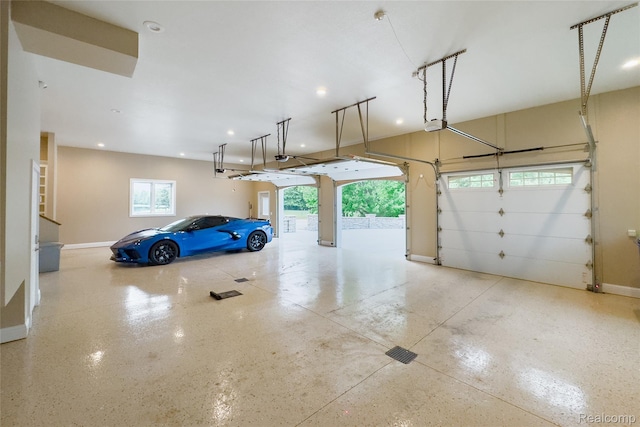 6312 S Graham Rd, Saint Charles, MI 48655 - garage with baseboards, recessed lighting, and a garage door opener