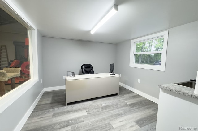 6312 S Graham Rd, Saint Charles, MI 48655 - office space with wood finished floors, baseboards, and a sink