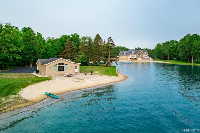 6312 S Graham Rd, Saint Charles, MI 48655 - view of swimming pool with a water view, a forest view, a yard, and a patio