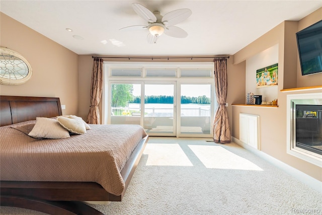 6312 S Graham Rd, Saint Charles, MI 48655 - bedroom with access to exterior, carpet flooring, multiple windows, and baseboards