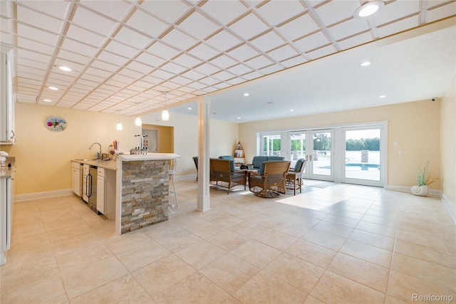 6312 S Graham Rd, Saint Charles, MI 48655 - kitchen with wine cooler, light countertops, a peninsula, open floor plan, and a sink