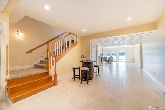 6312 S Graham Rd, Saint Charles, MI 48655 - stairs with baseboards, recessed lighting, and tile patterned flooring