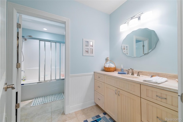 6312 S Graham Rd, Saint Charles, MI 48655 - full bath featuring vanity, a wainscoted wall, bathing tub / shower combination, and tile patterned floors